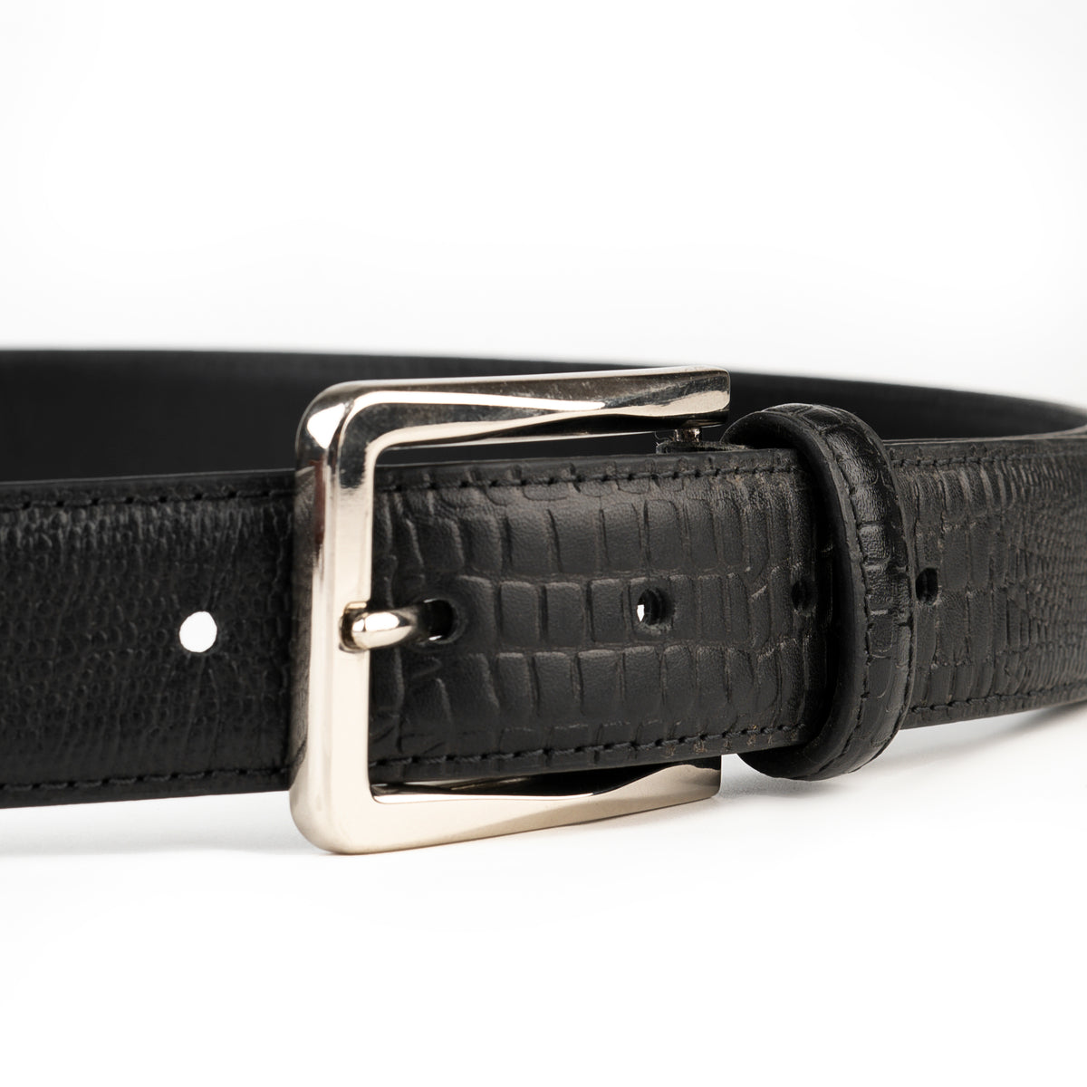 Black crocodile-print leather belt buckle close-up
