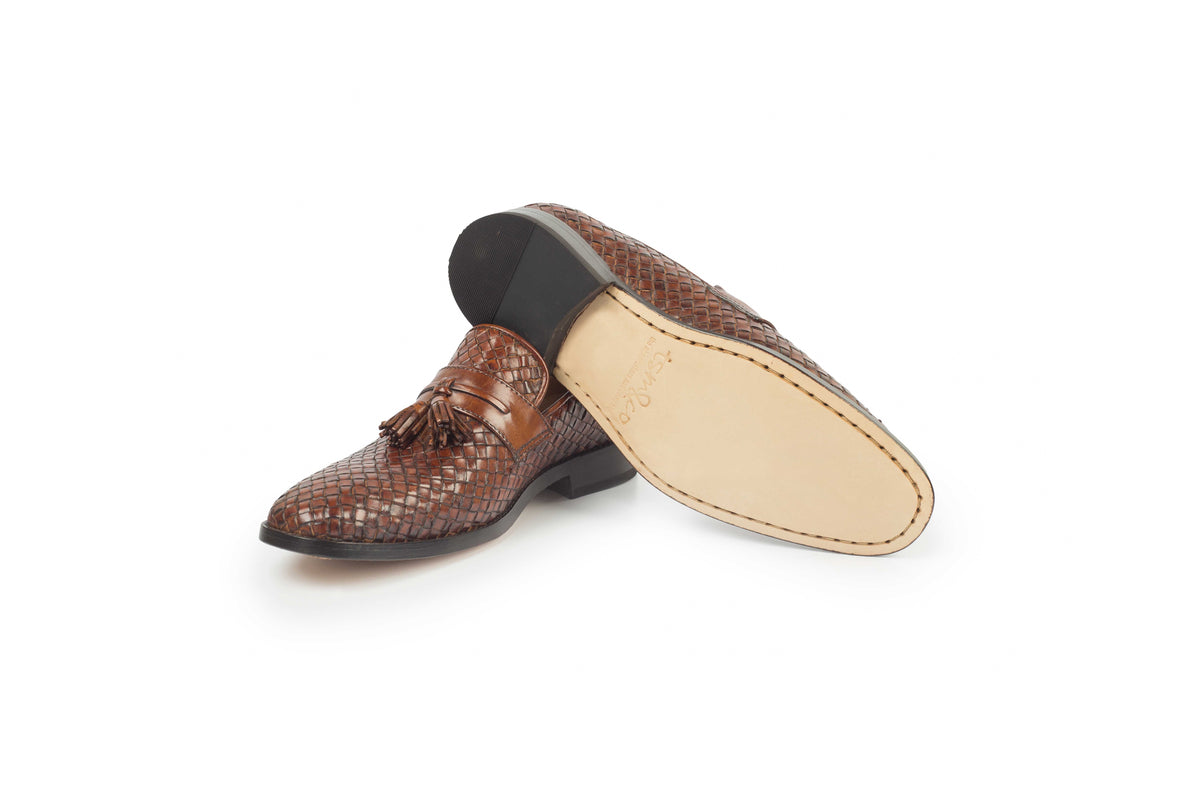 Tuscany Camel Patina woven tassel loafer - leather sole view